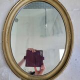 Oval mirror in gilded stucco 45 cm