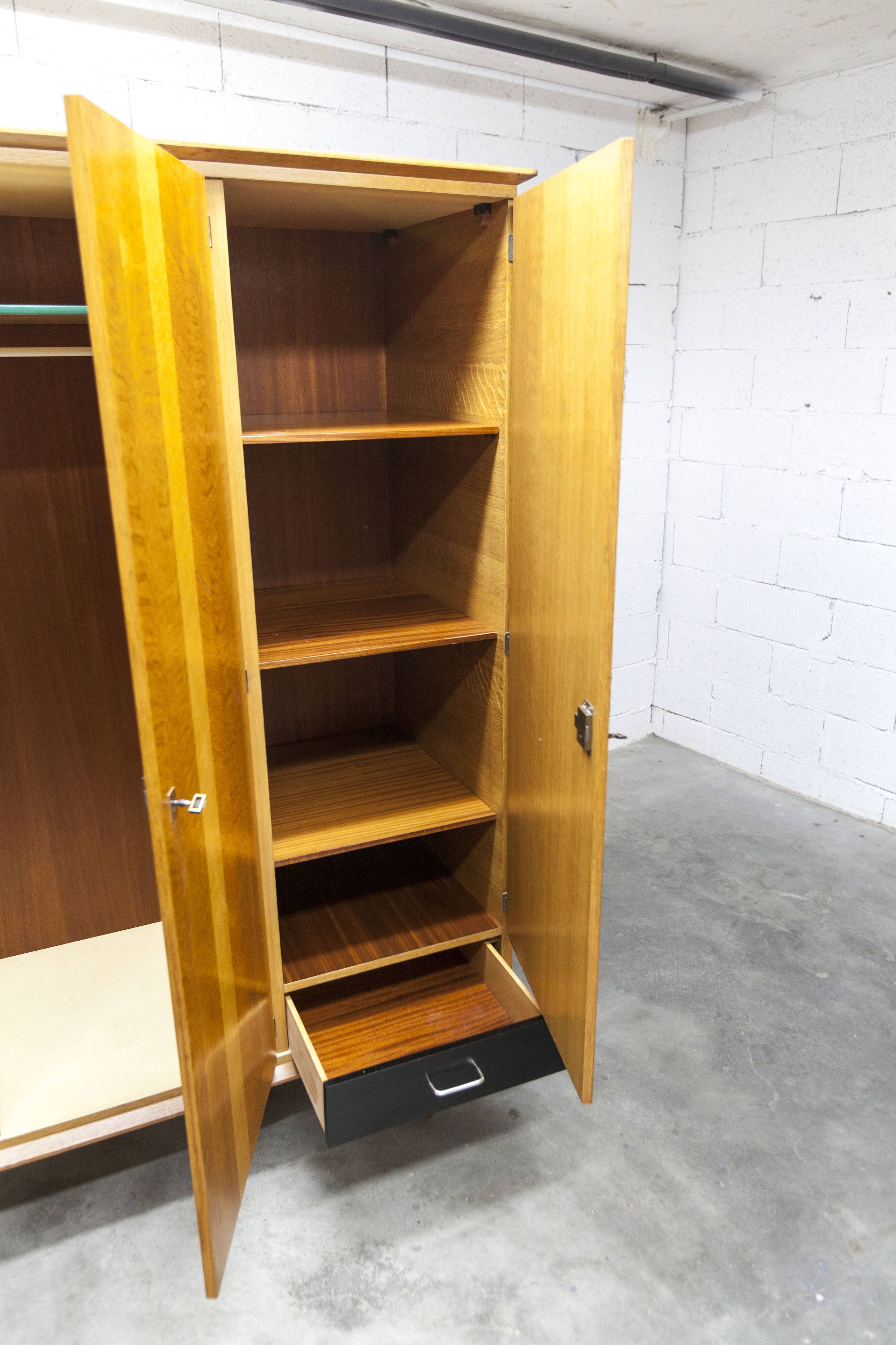 French wardrobe with tapered legs, 3 doors, 1 mirror (27*130), and 1 drawer.