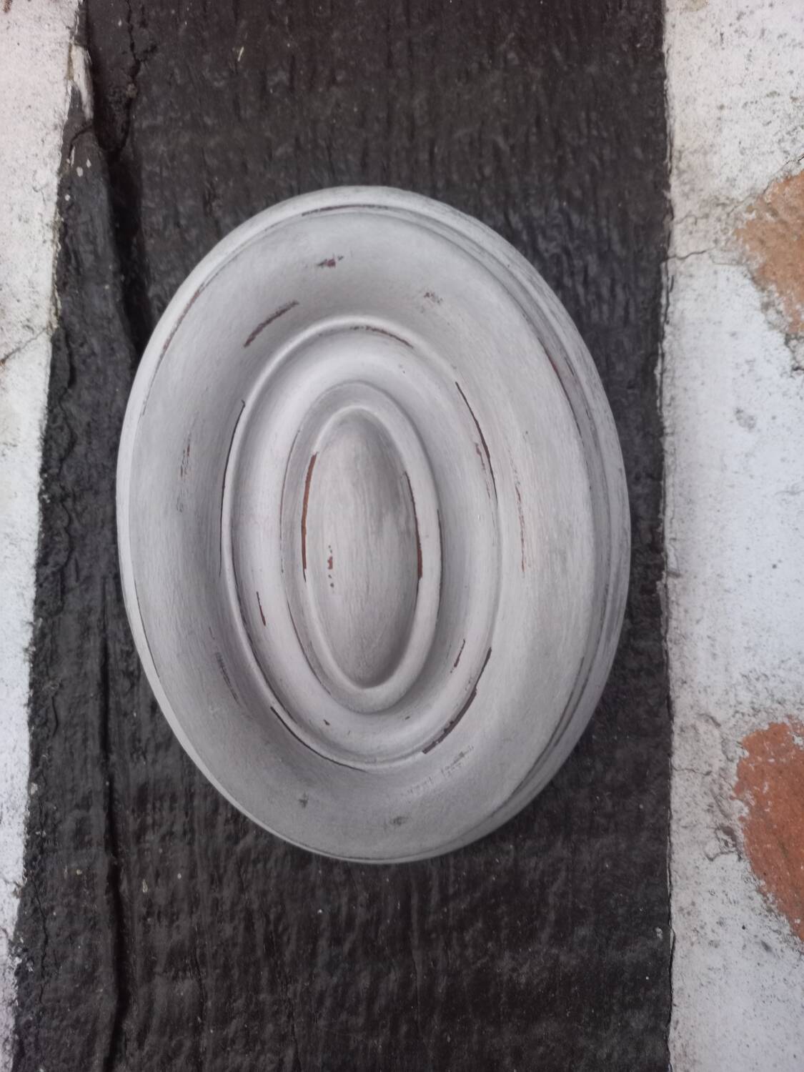 Pair of patinated oval woodwork