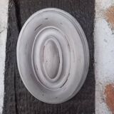 Pair of patinated oval woodwork