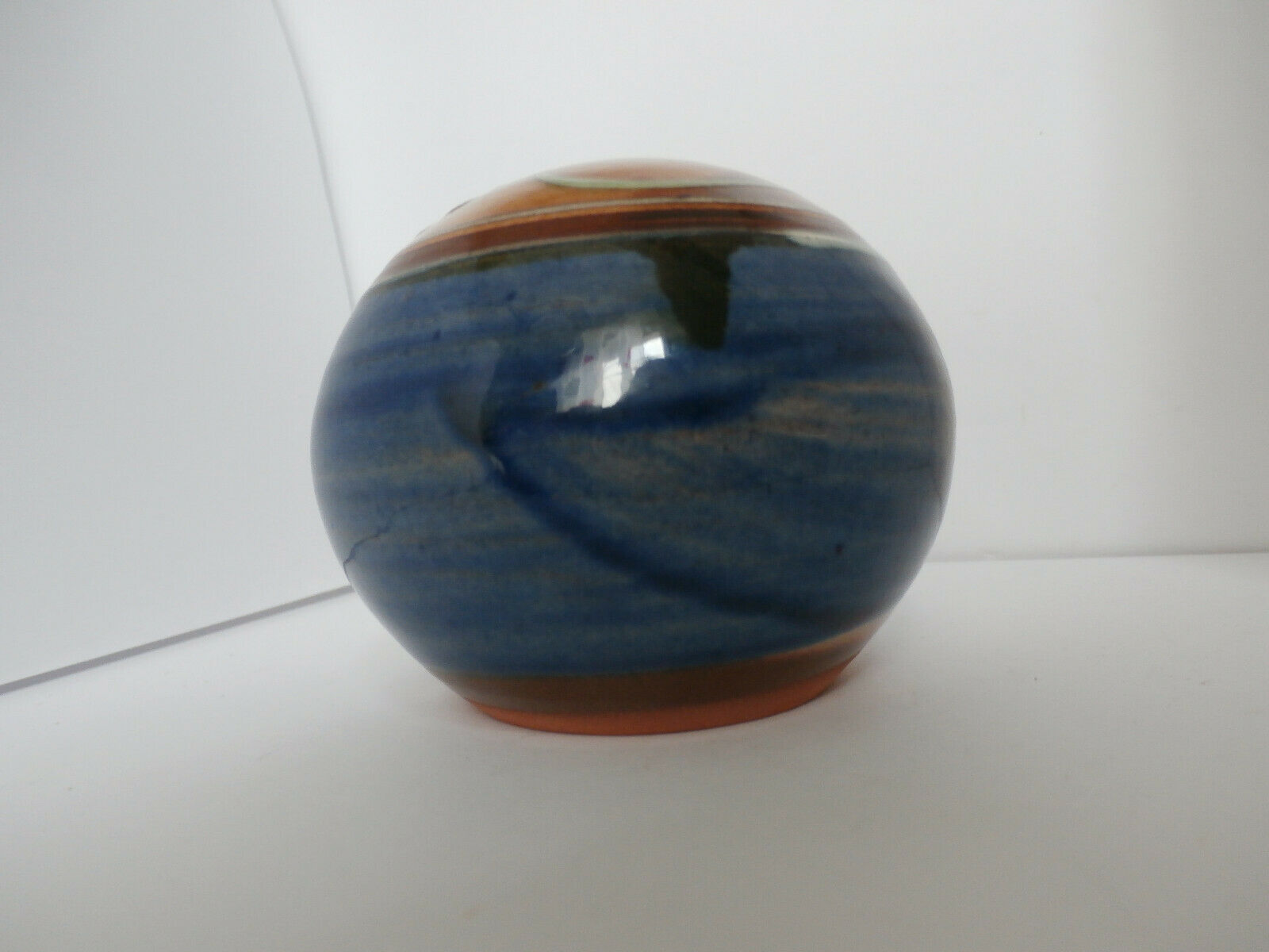 Glazed terracotta ball signed Otto Lindner