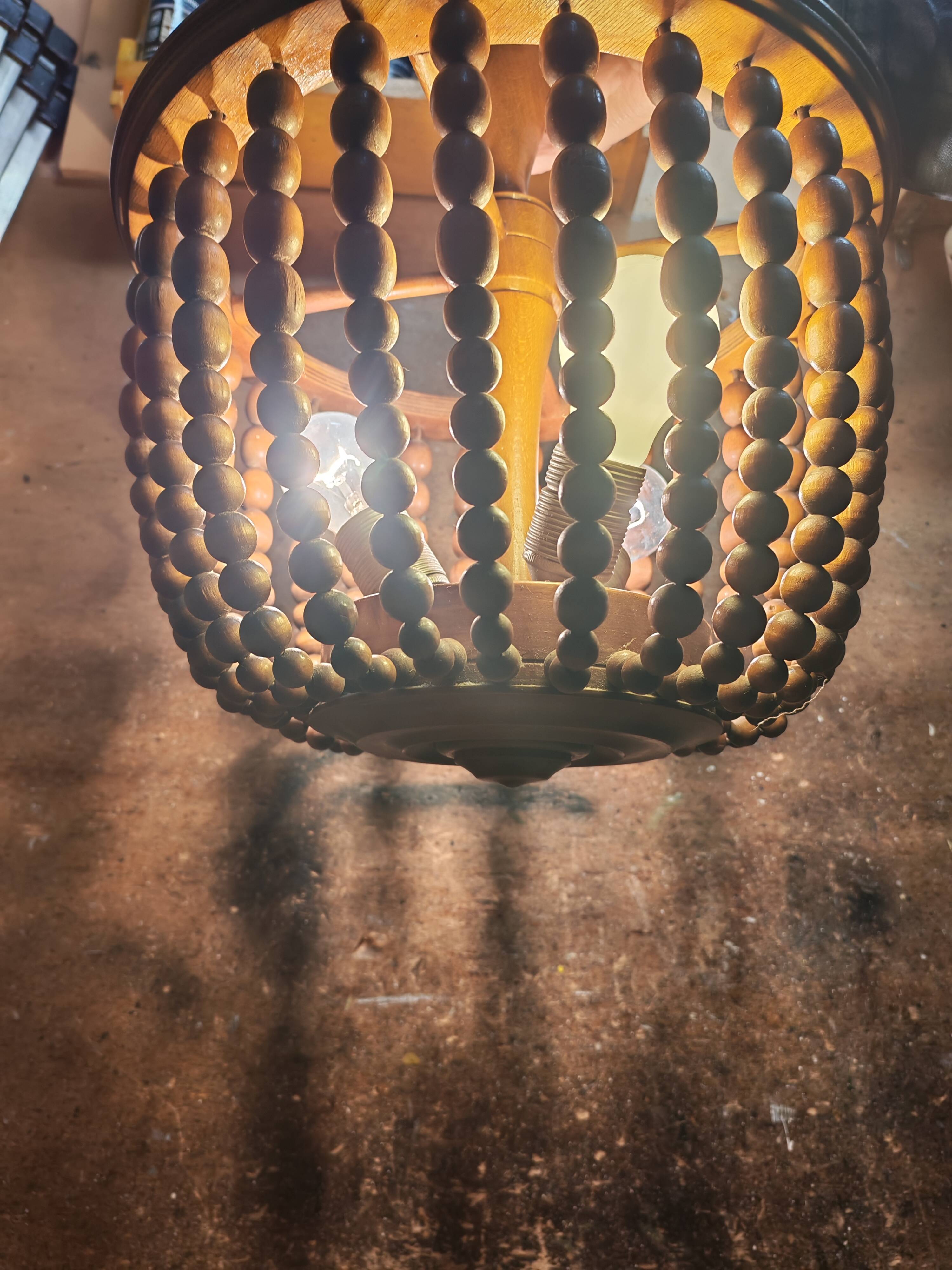 Vintage wooden turned cage chandelier with beads from the 1960s.