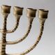 Vintage brass candlestick from the 1950s, seven-branched menorah with ornamental decoration.