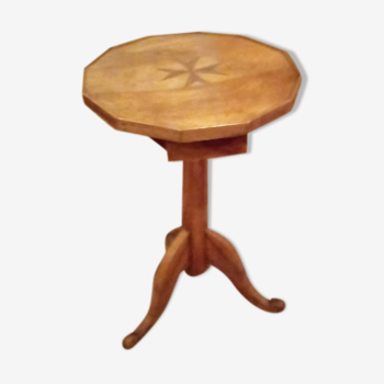 Solid walnut pedestal table with a marquetry Maltese cross on the top