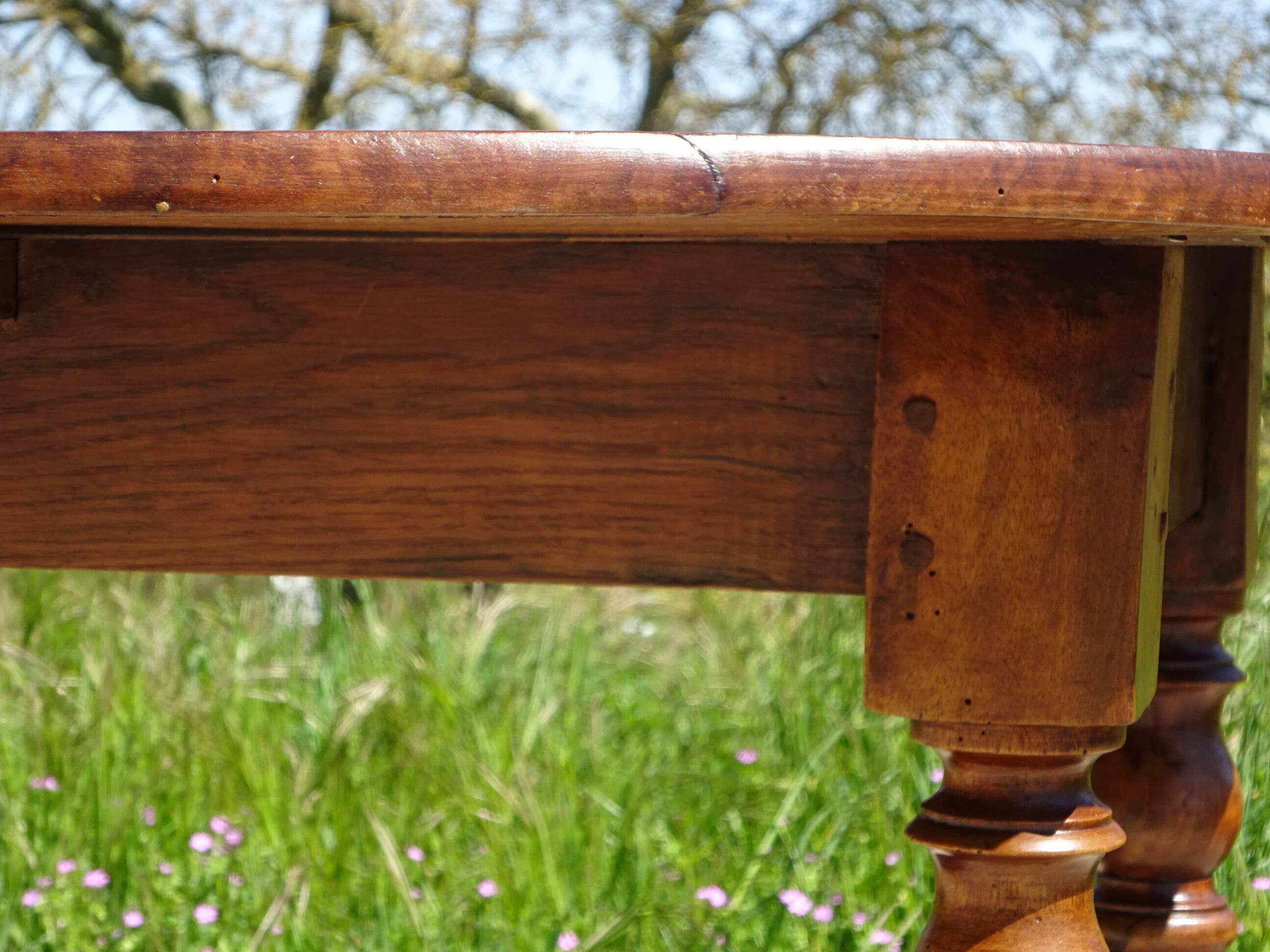 Antique walnut console table with honey spoon legs.