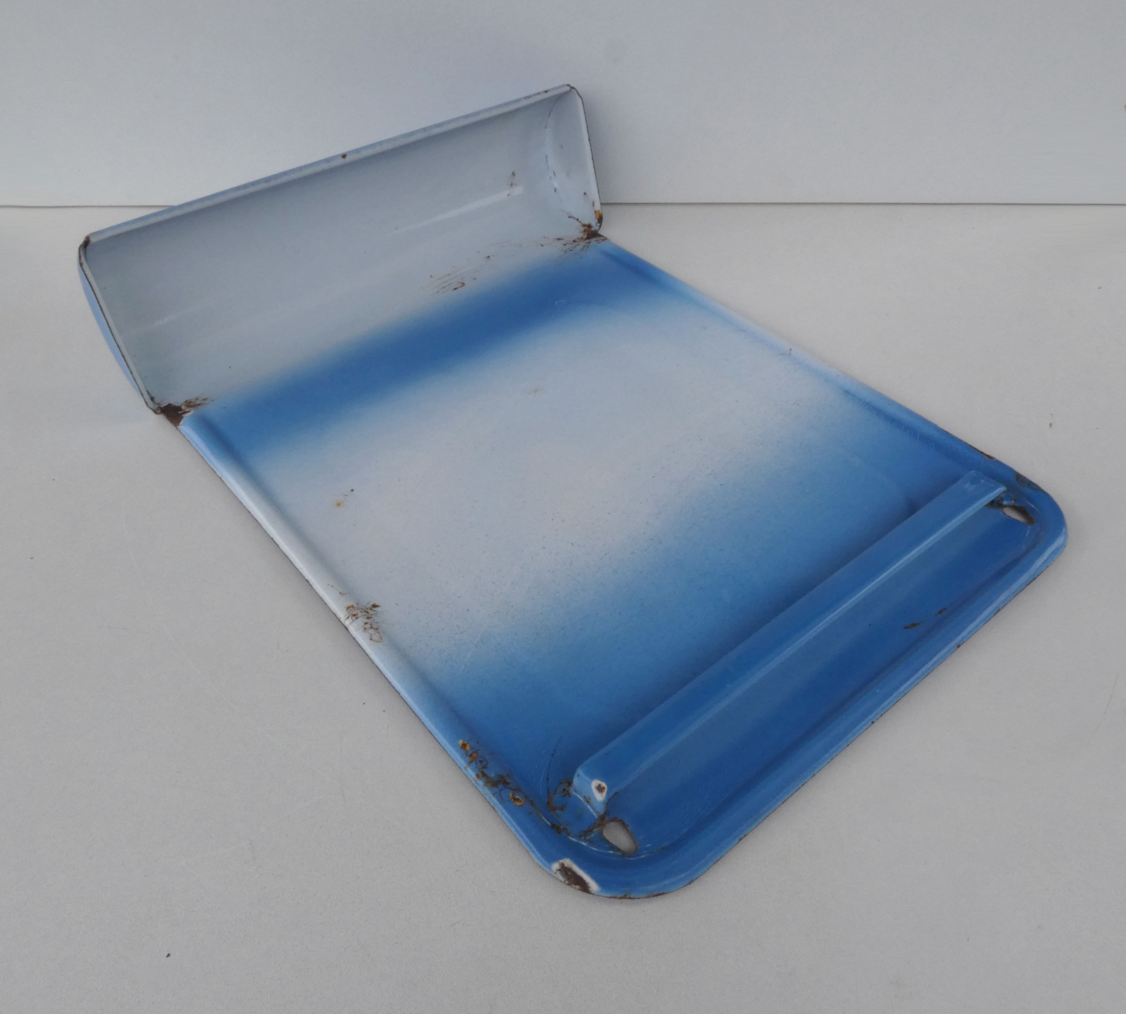 old blue enamelled steel utensil drainer