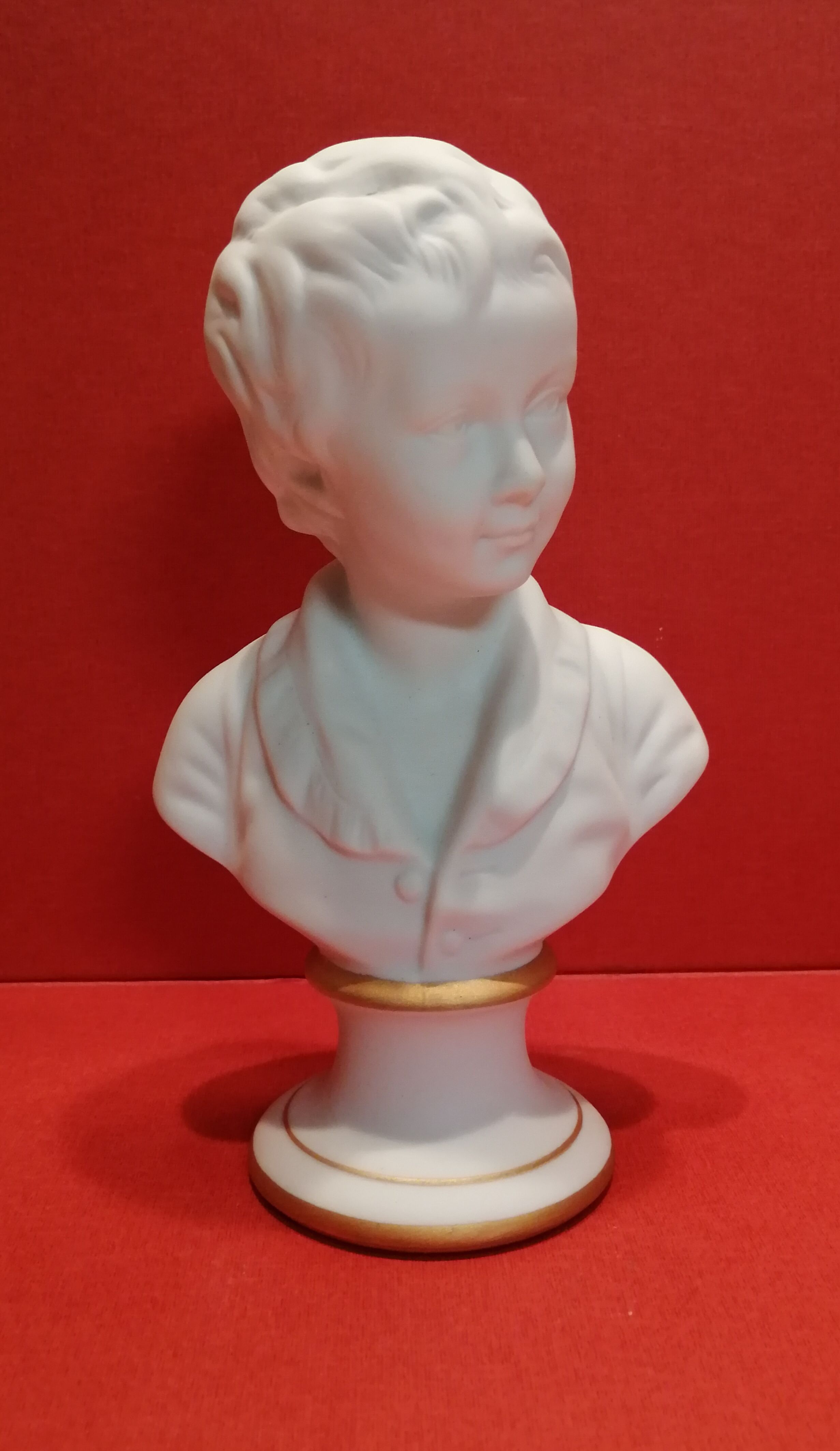 Small bust young boy in biscuit Tharaud Limoges