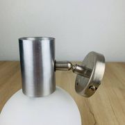 Space age opaline globe wall light, adjustable, and brushed metal, 1960s.