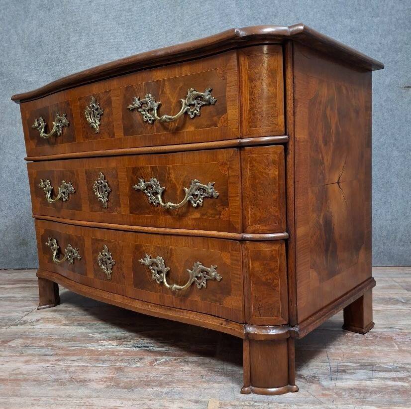 Curved commode from the Louis XIV period in marquetry - adorned with gilded bronze fittings.