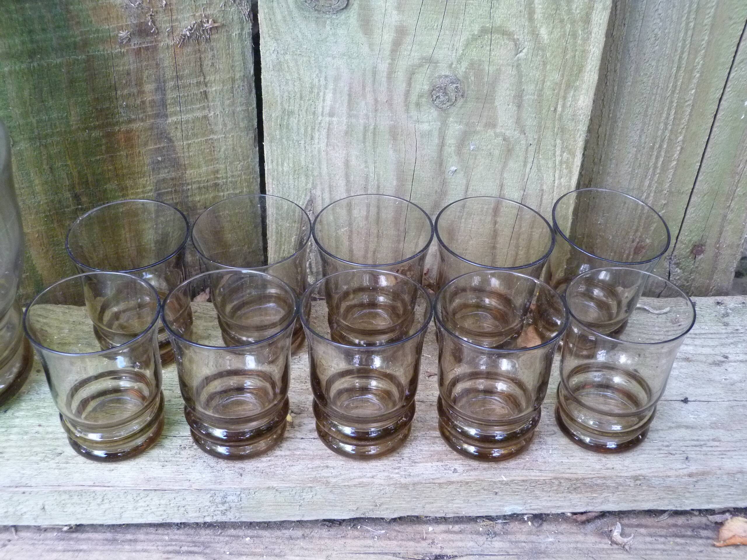 Set of 10 brown glasses and a carafe made in Belgium