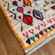 Berber carpet azimuth colored white with multicolored and fluorescent patterns