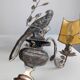 Pair of wall sconces with parrots and leaves