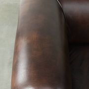 Set of a smooth chesterfield sofa and armchair with a timeless English look