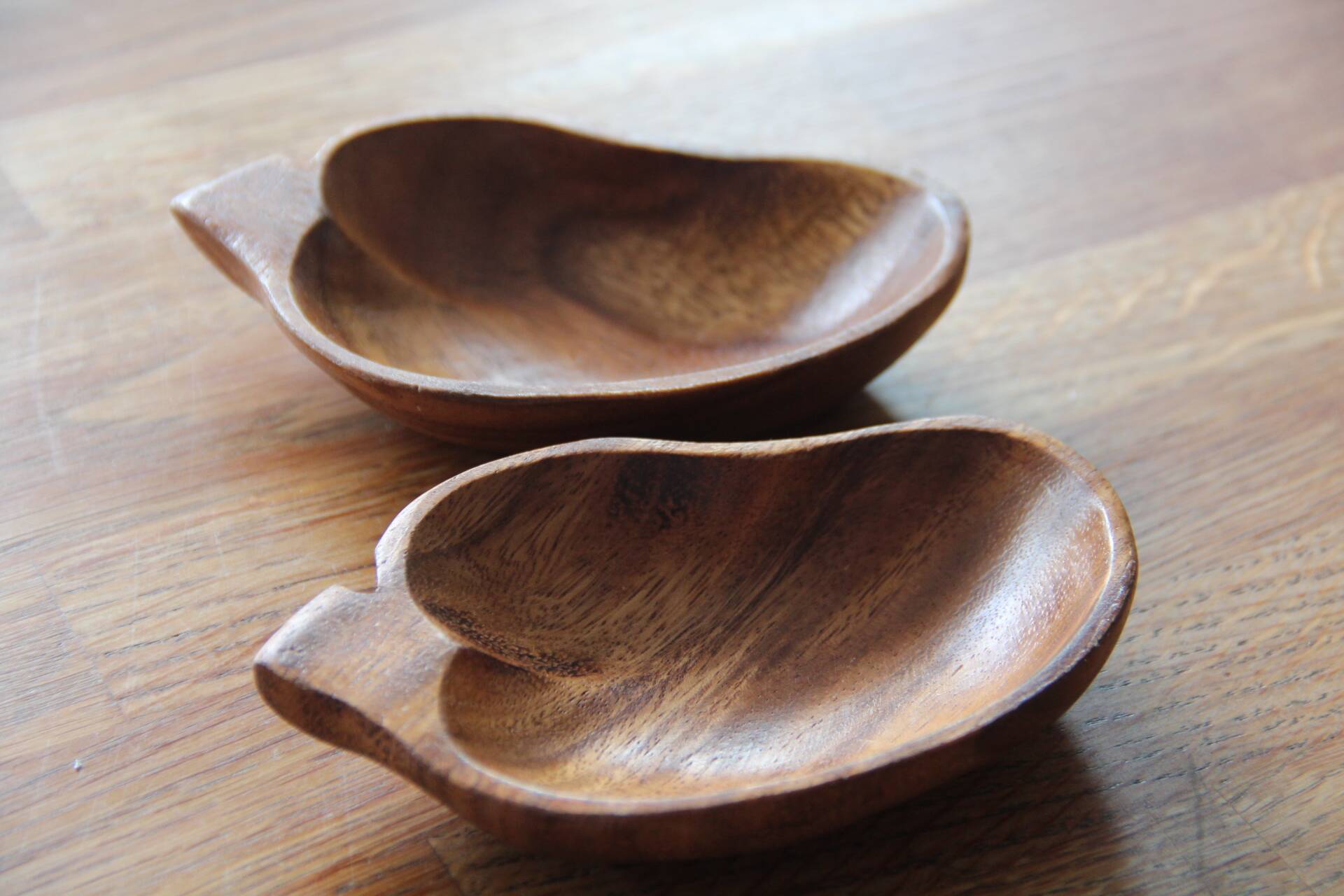 2 teak leaf-shaped trays