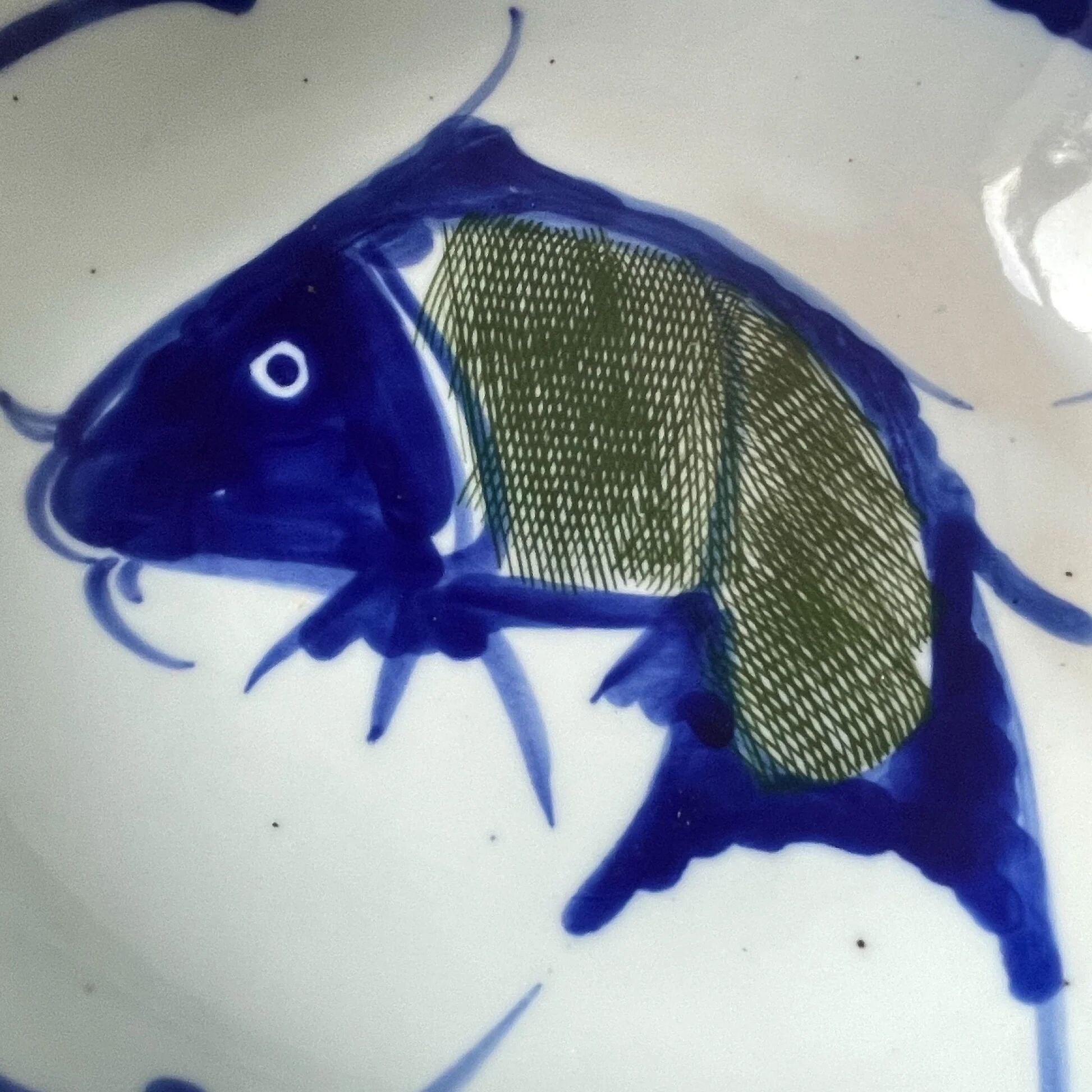 Hand-painted Chinese porcelain bowl with blue fish