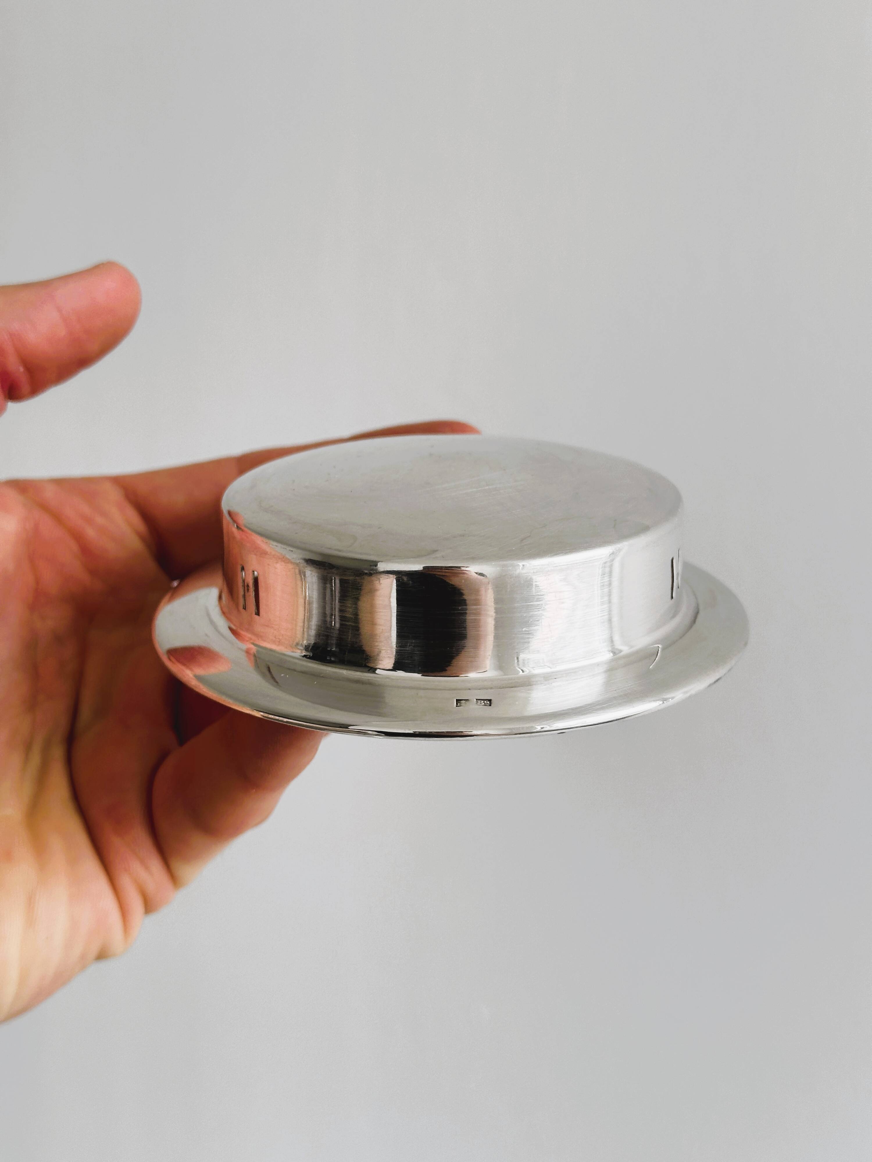 Antique butter dish in shiny metal