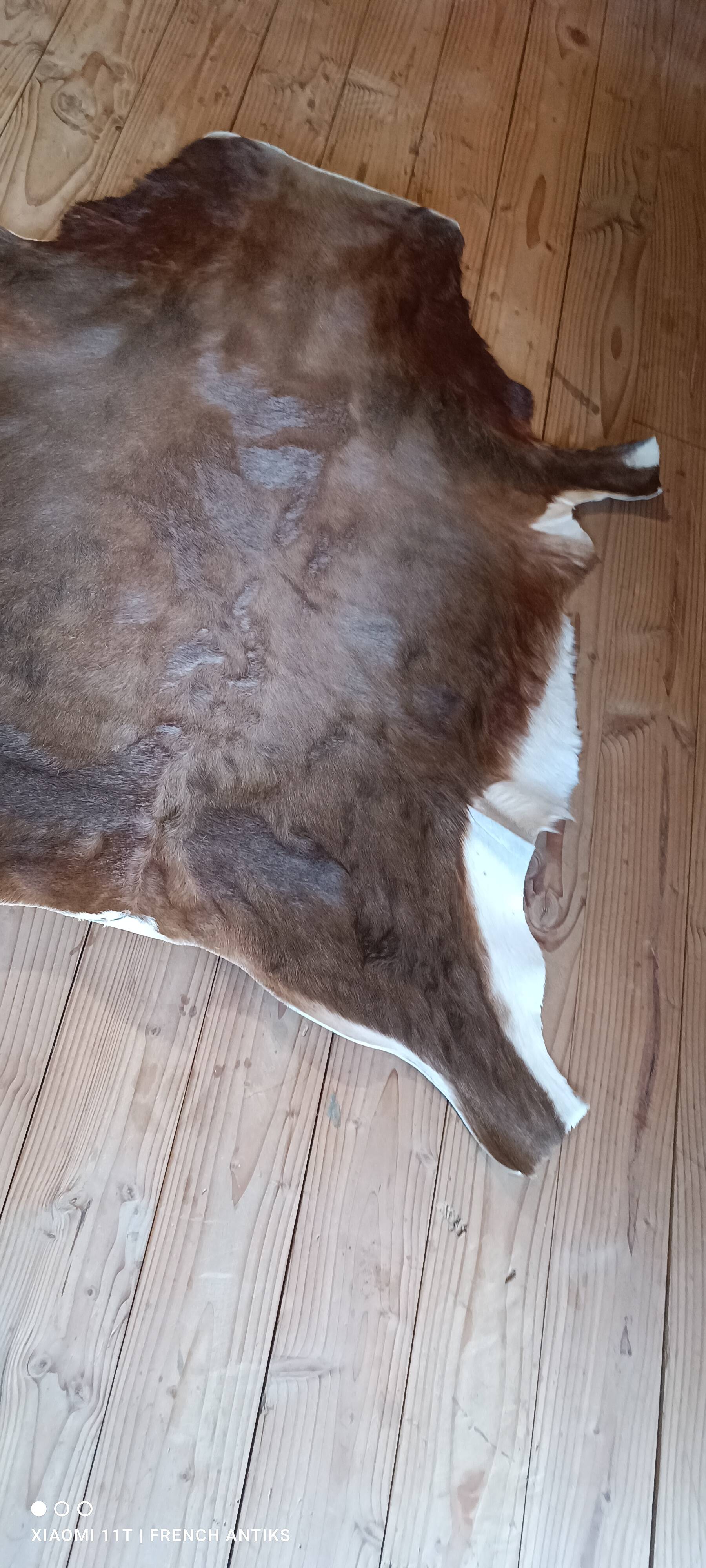 Cowhide rug, vintage from the 1980s. Handmade, made by me.