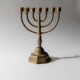 Vintage brass candlestick from the 1950s, seven-branched menorah with ornamental decoration.