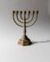 Vintage brass candlestick from the 1950s, seven-branched menorah with ornamental decoration.
