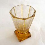 Art Deco vase engraved with flowers, faceted body on a pedestal.