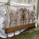 Golden wrought iron bedhead