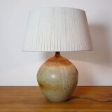 Large stone lamp with a cotton shade.