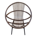 Shell-shaped armchair in rattan with metal legs. Caravane brand.