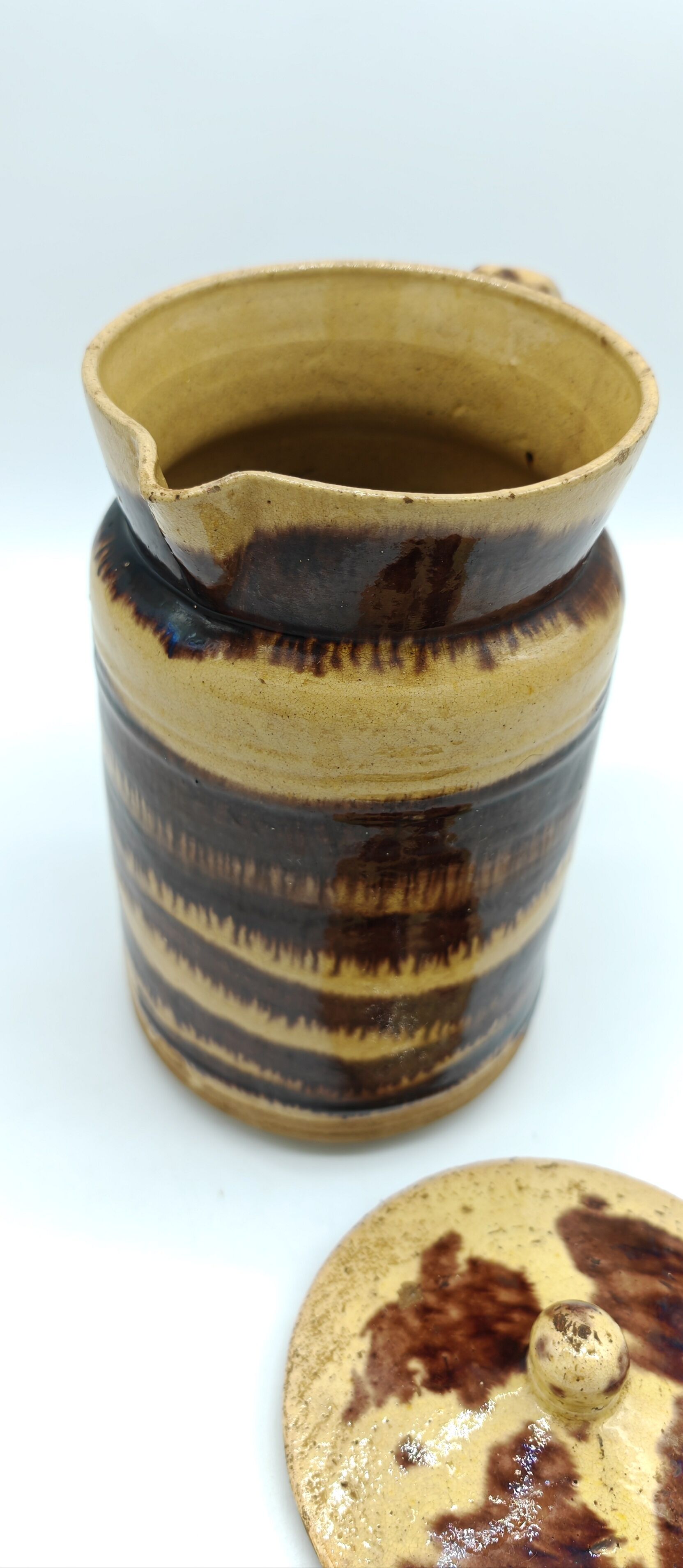 Pitcher covered in glazed earth old french tabby dishes