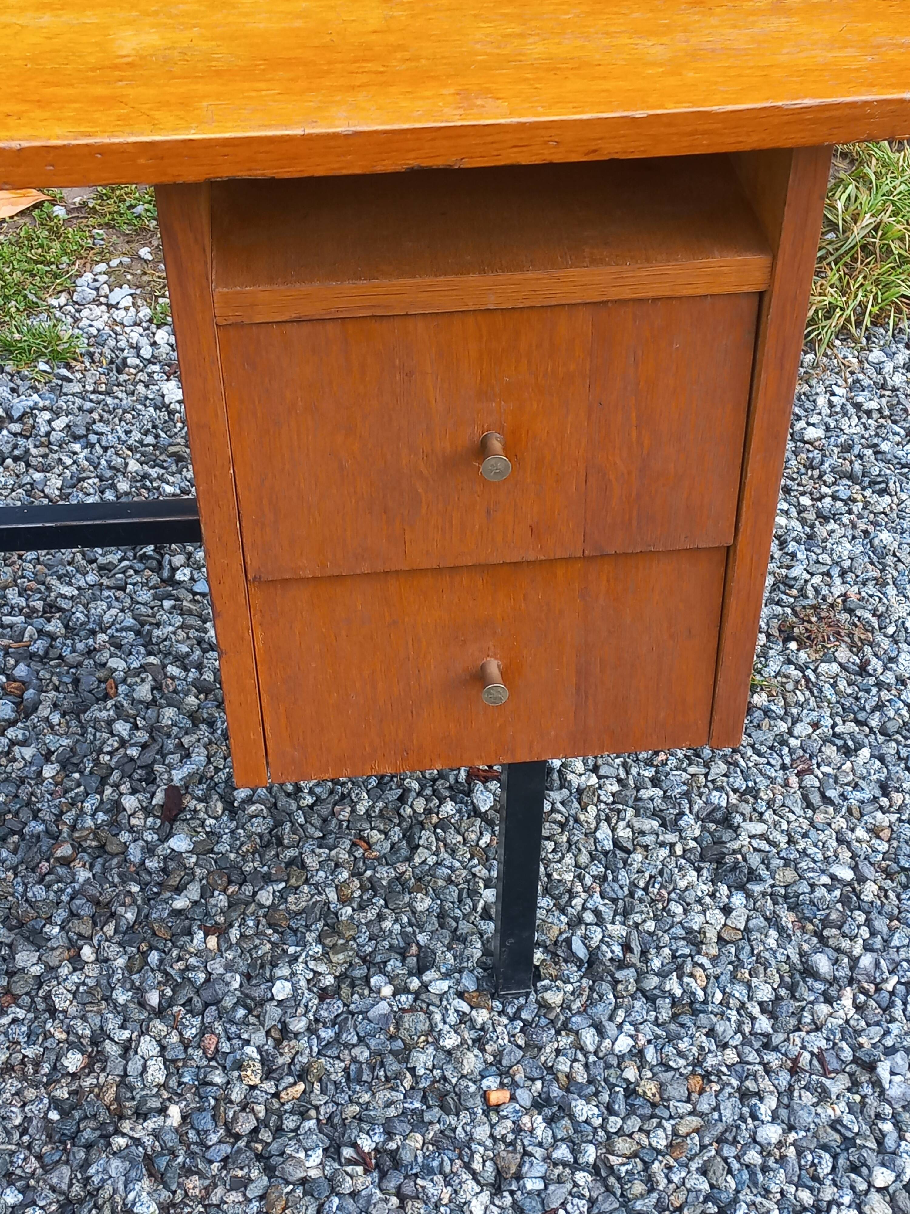 Vintage oak desk with a metallic base from the 1960s.