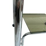 Smoked glass and chrome metal table with casters