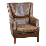 Grained cowhide armchair with a timeless design