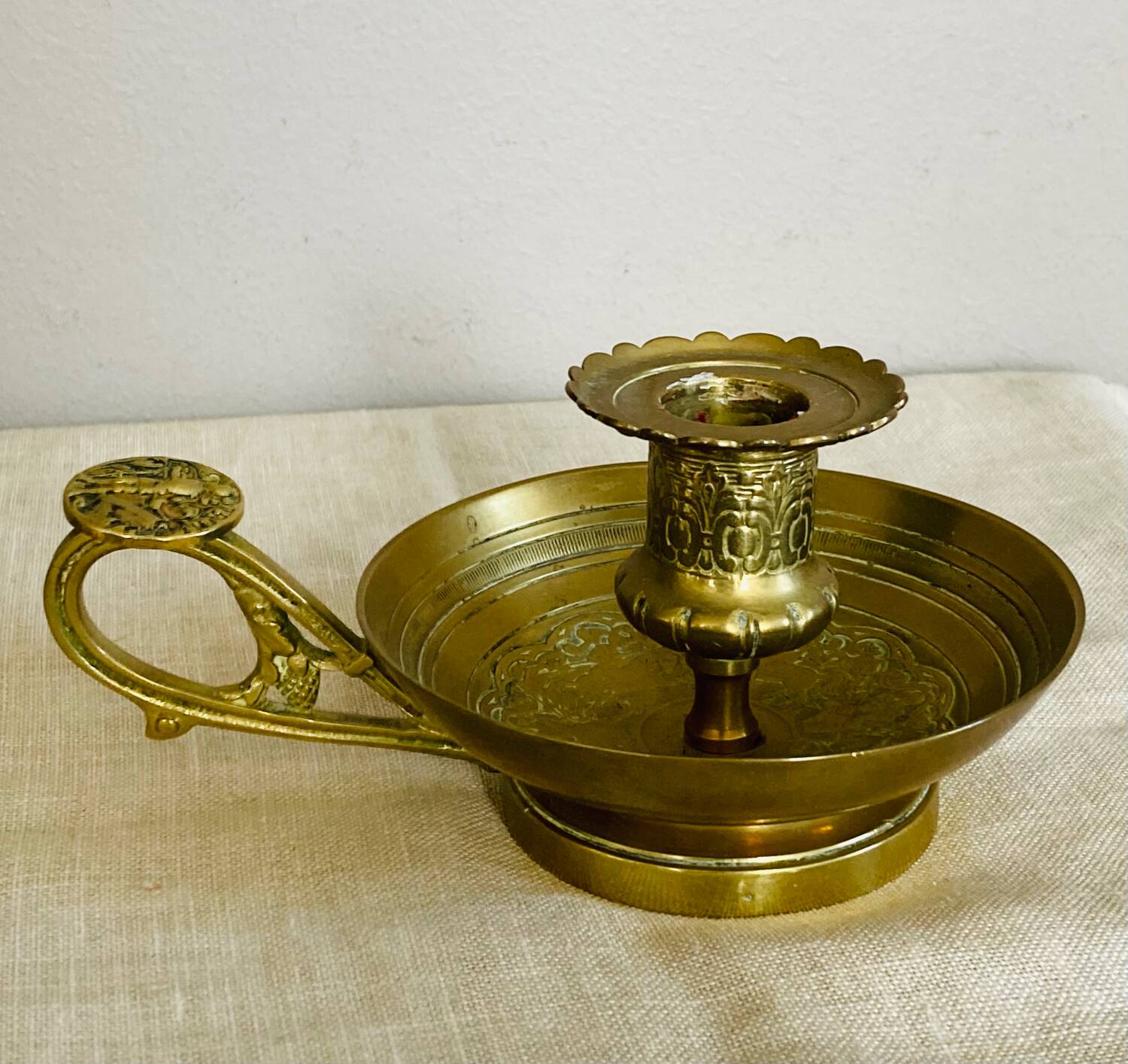 20th century chiseled brass socket candle holder representing Horsemen in armor