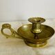 20th century chiseled brass socket candle holder representing Horsemen in armor