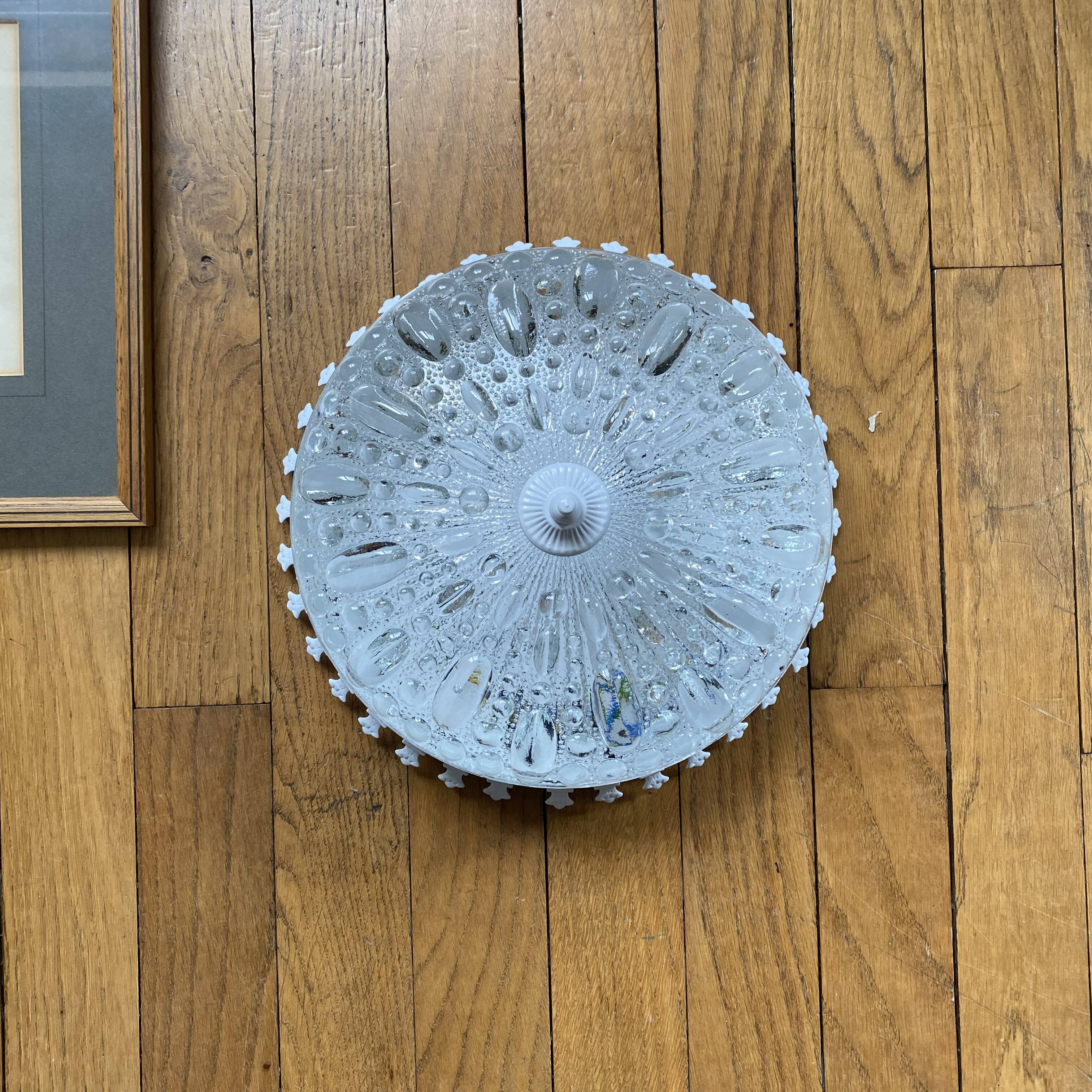 Antique ceiling light with transparent glass and white metal.