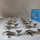 12 silver metal whale knife rests