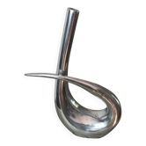 Sculptural vase design in polished aluminium.