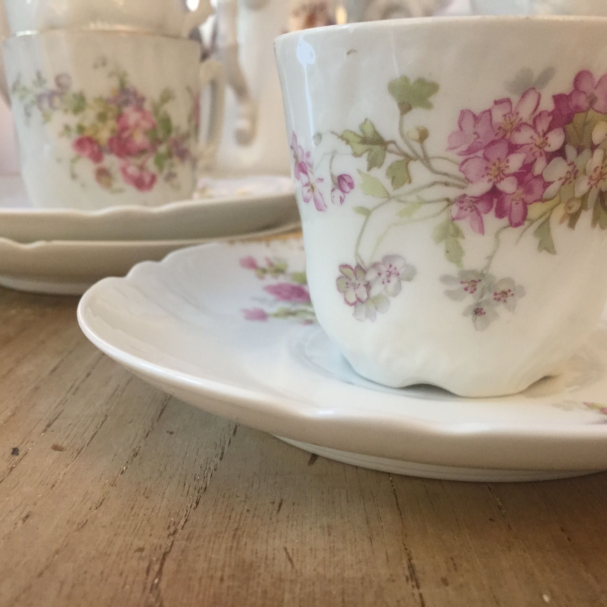 6 antique cups and mismatched saucers