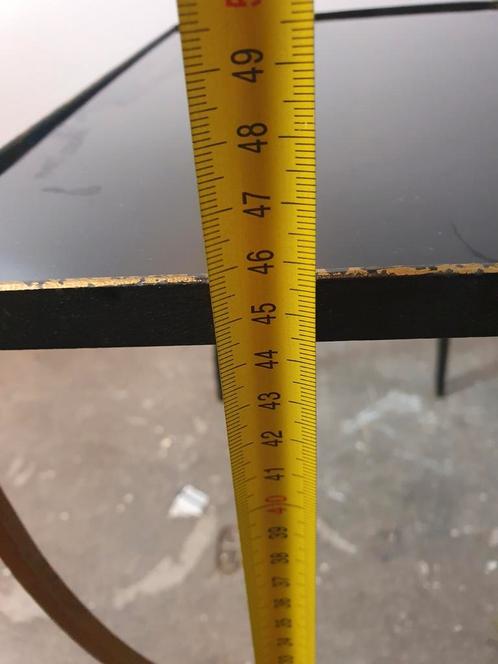 Vintage cast iron and black glass side table