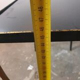 Vintage cast iron and black glass side table