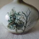 Glazed ceramic ball lamp signed Bossis with a fabric shade.