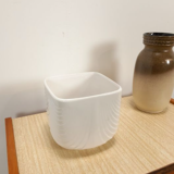 Vintage white flower pot with relief