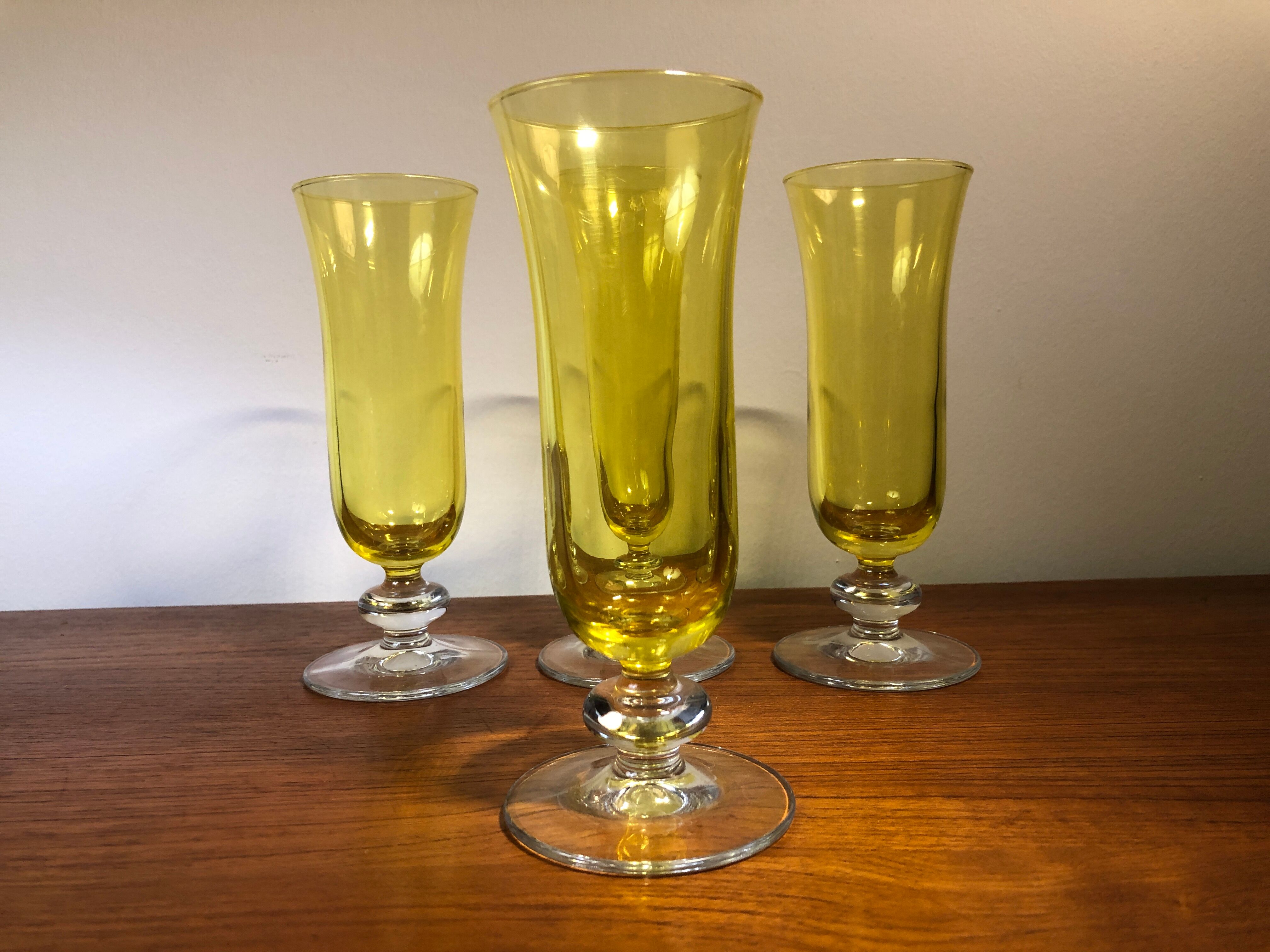 Large transparent yellow champagne flutes