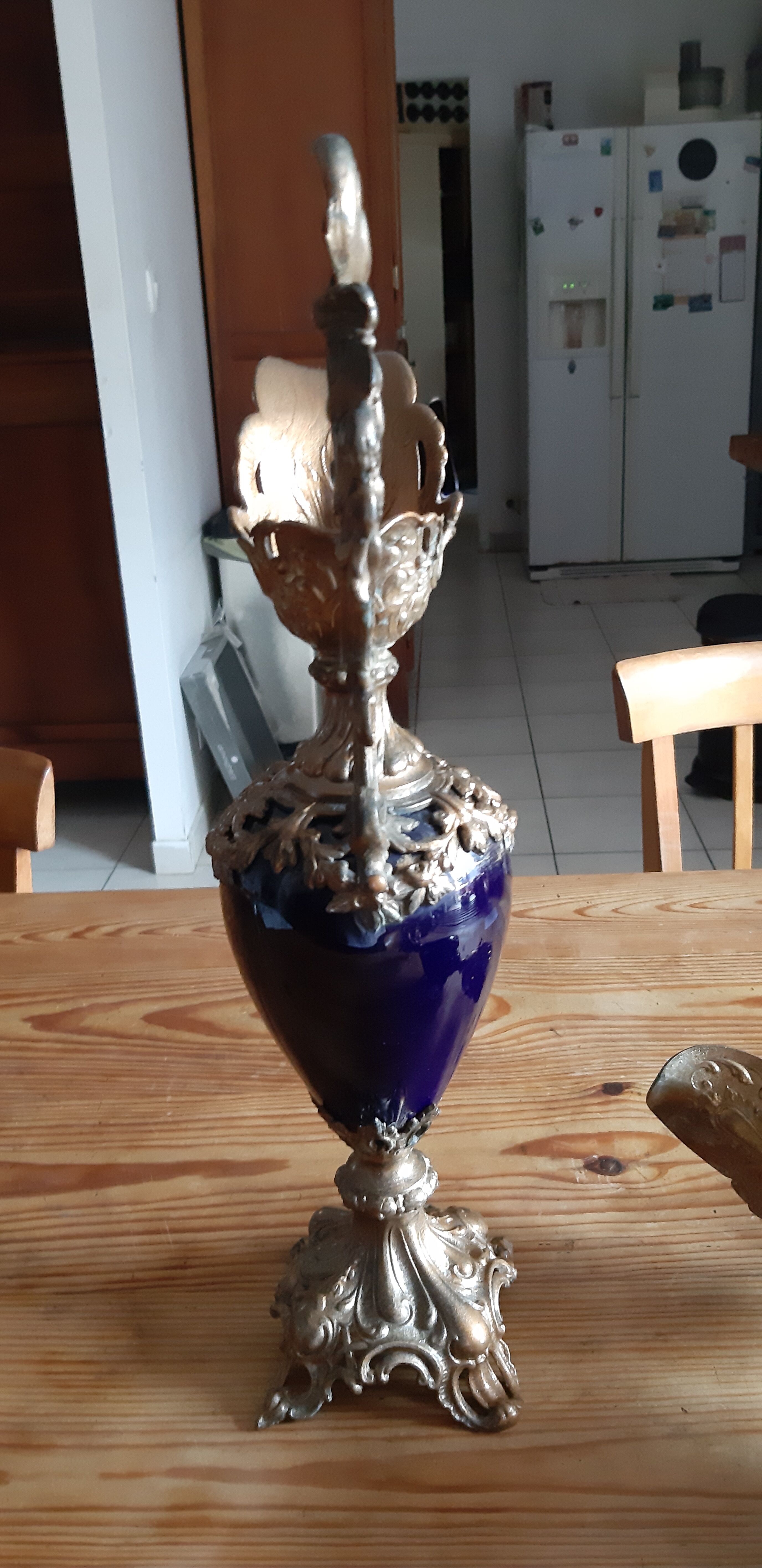 Pair of golden regulated ewers and blue glass