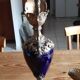Pair of golden regulated ewers and blue glass