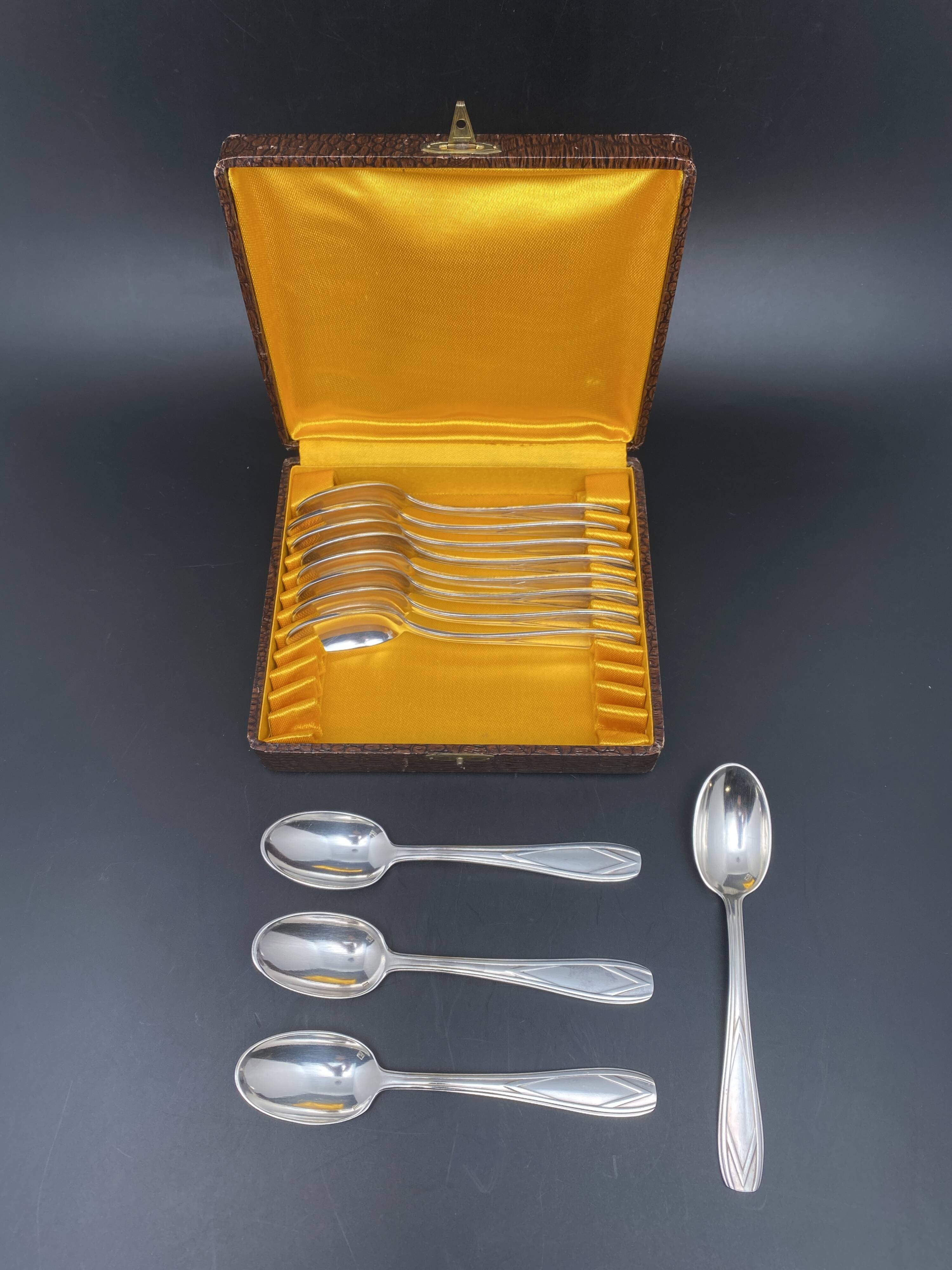 Dessert spoons in silver-white metal