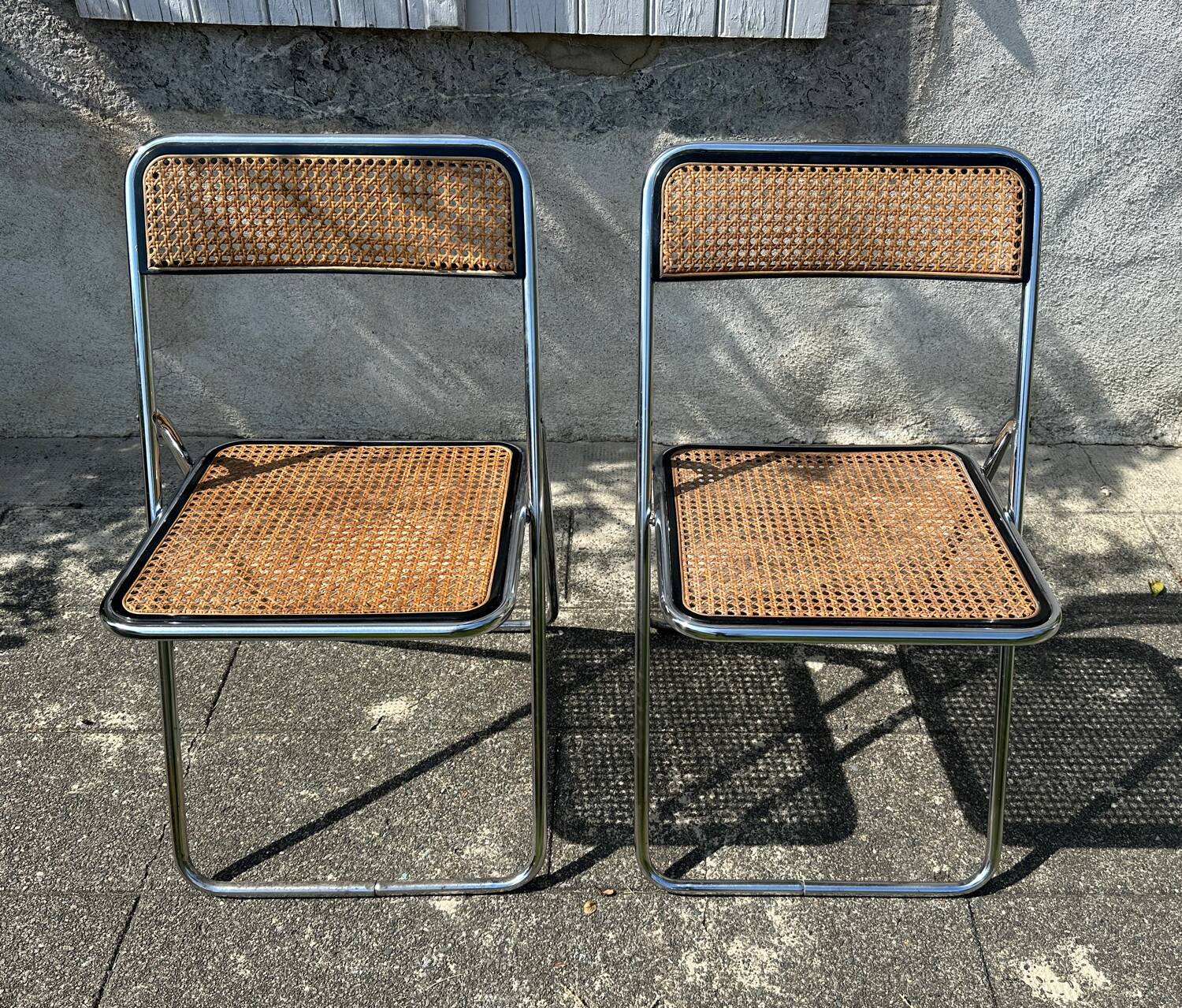 Pair of vintage metal caned folding chairs