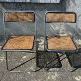 Pair of vintage metal caned folding chairs