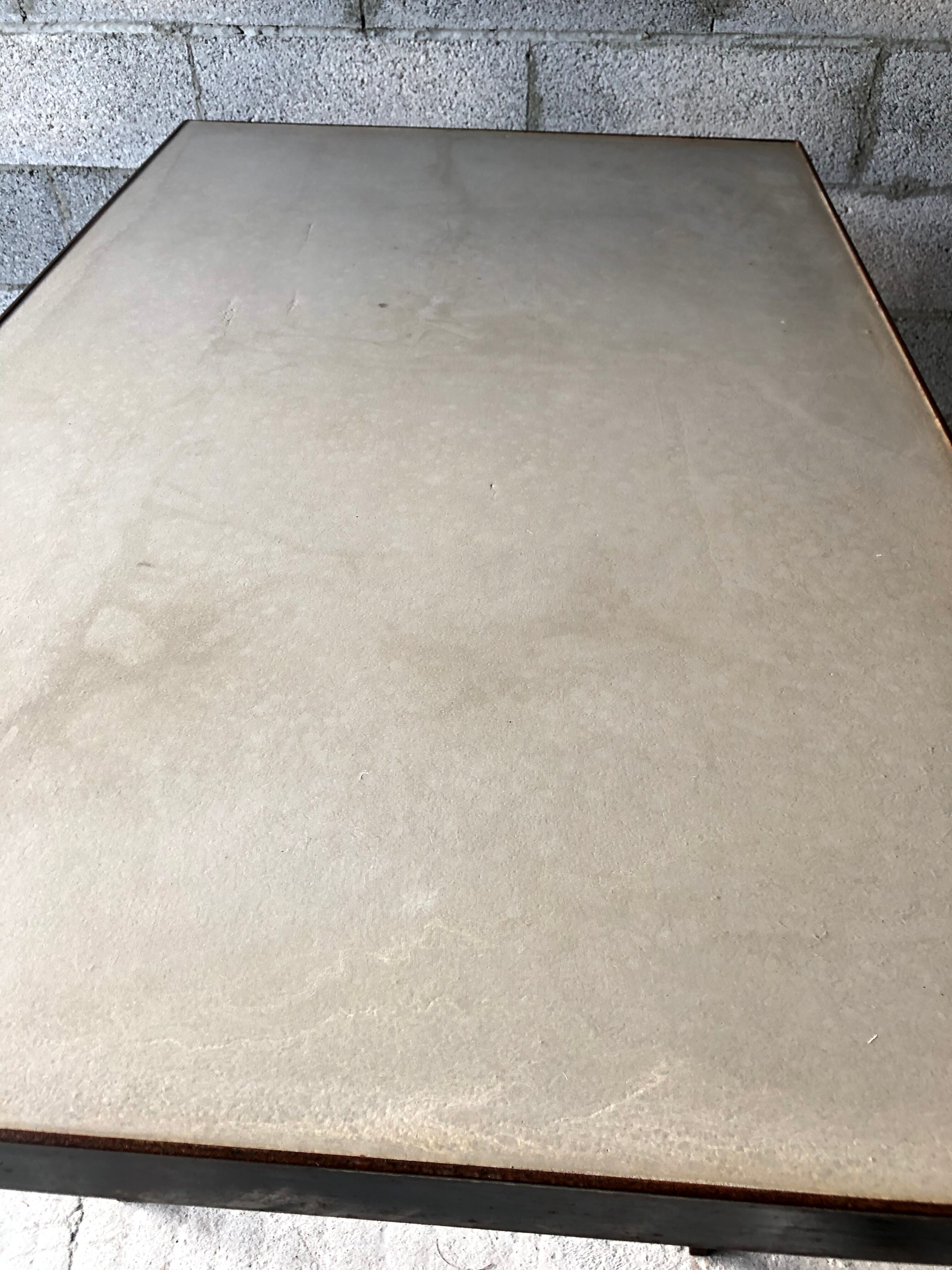 Table made of wrought iron and cement