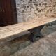 Old French industrial table with a cast iron base and a pine top.