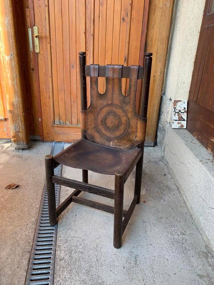 Handcrafted brown leather armchair, dark wood frame, circular pattern - 1970s.
